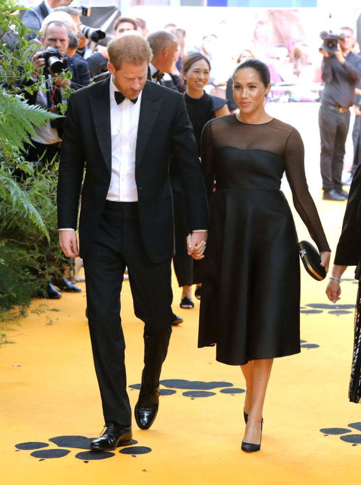 Meghan Markle Spellbinds In A Flattering $2,450 Black Gown With A Sheer Detail At 'The Lion King' Red CarpetMeghan Markle Spellbinds In A Flattering $2,450 Black Gown With A Sheer Detail At 'The Lion King' Red CarpetMeghan Markle Spellbinds In A Flattering $2,450 Black Gown With A Sheer Detail At 'The Lion King' Red Carpet