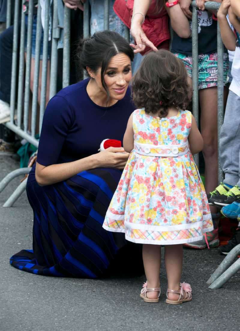 She'll Do It Her Way: Meghan Markle Plans To Raise Her Children Differently Than Kate Middleton, Reports SayMegan, Duchess of Sussex speaks to little Catalina Rivera, 2, who got through the railings during a walkabout at Government Gardens